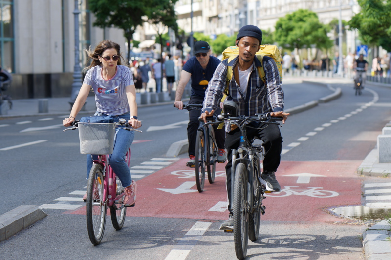 22 - Urban cyclists riding on a dedicated city bike lane